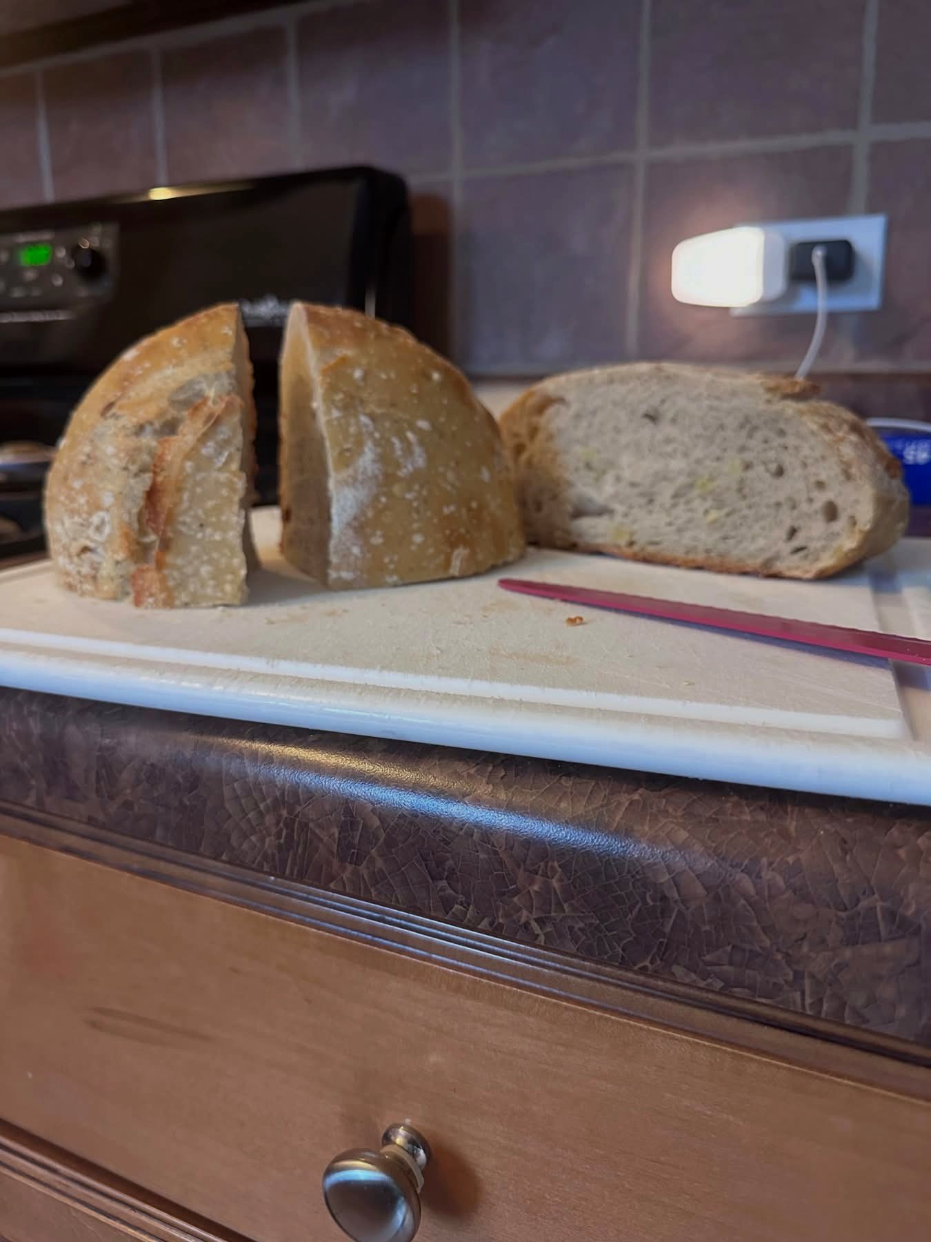 A sliced sourdough loaf showing an open, airy crumb structure