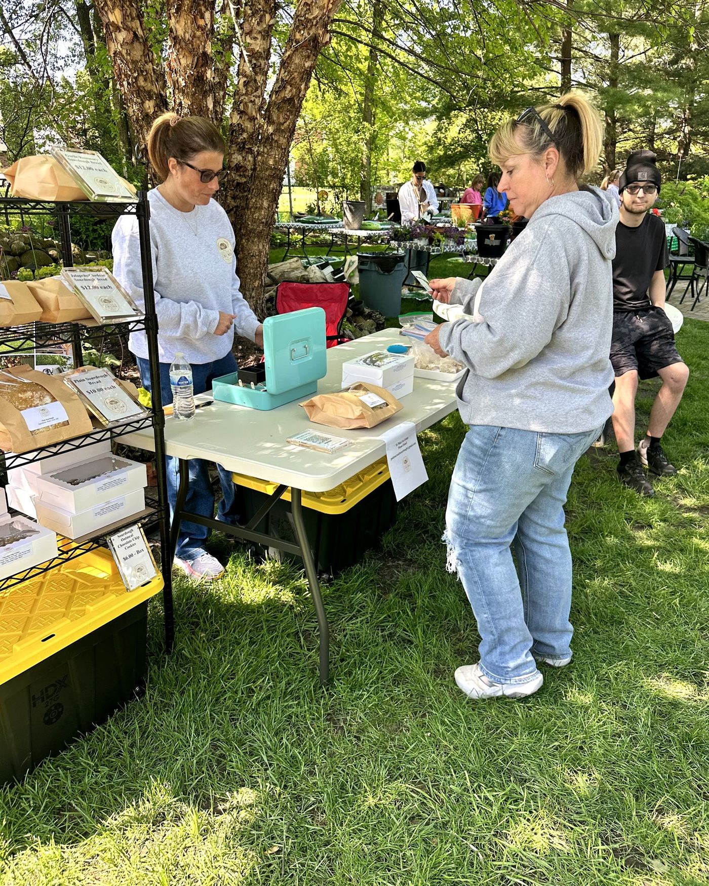 Michelle helping a customer at the booth