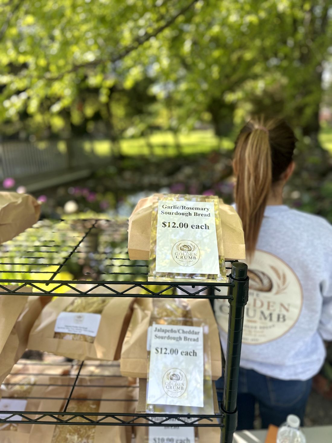 Garlic and Rosemary price card with the Golden Crumb branded sweatshirt